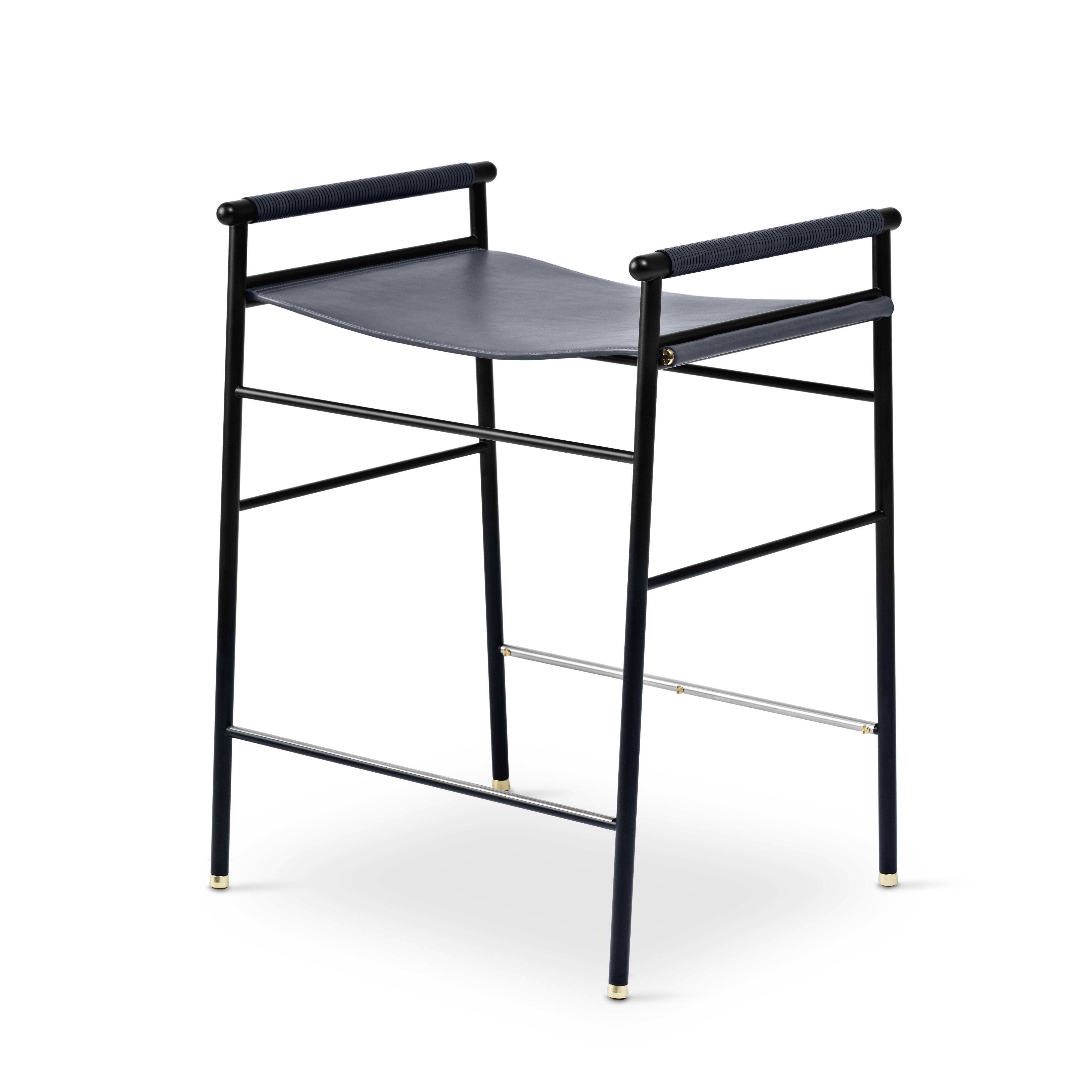 Contemporary artisan bar stool in navy blue leather and black rubber metal.