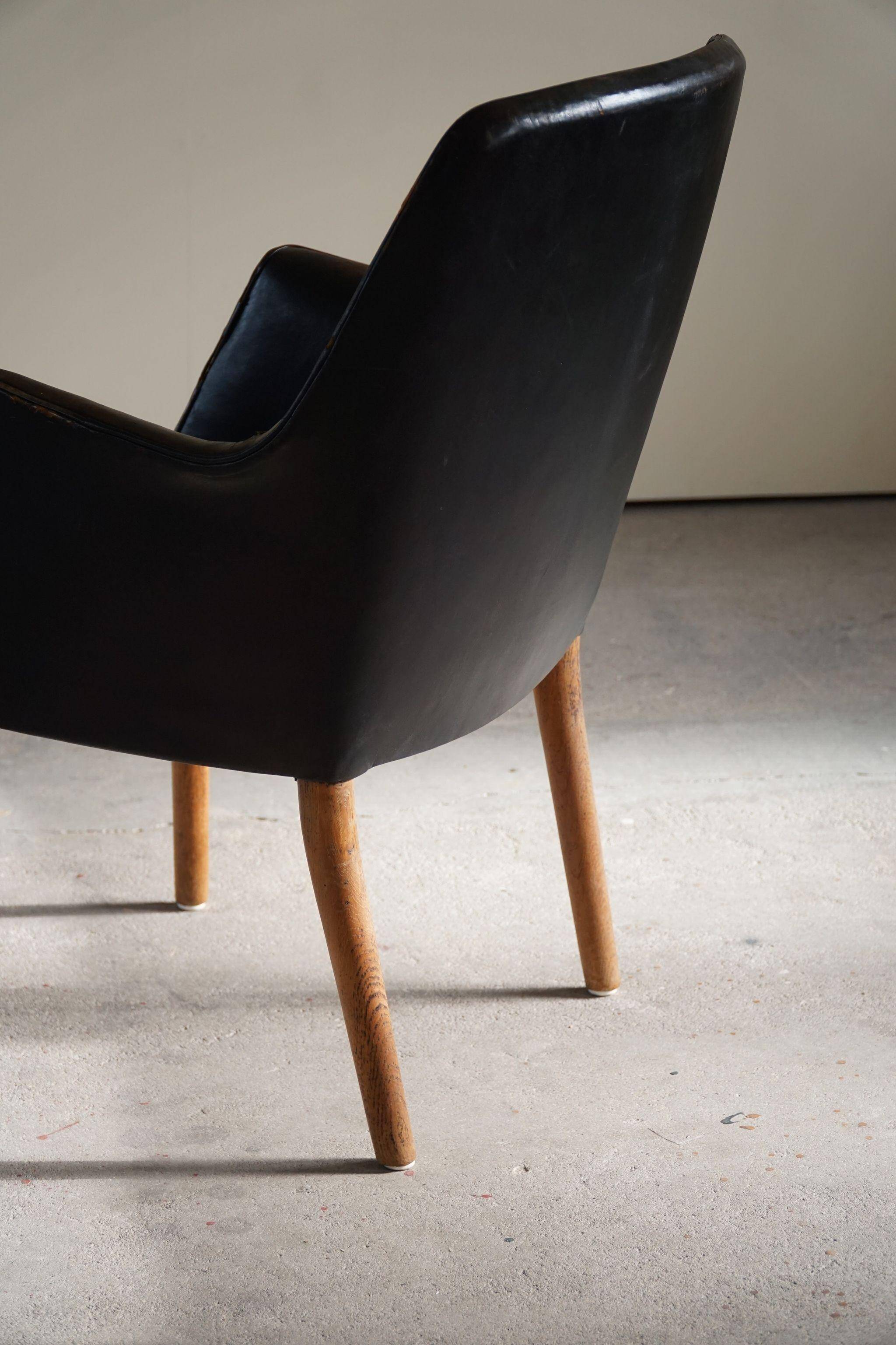 Fauteuil Danemark Moderne par Nanna Ditzel en chêne et cuir patiné, années 1950