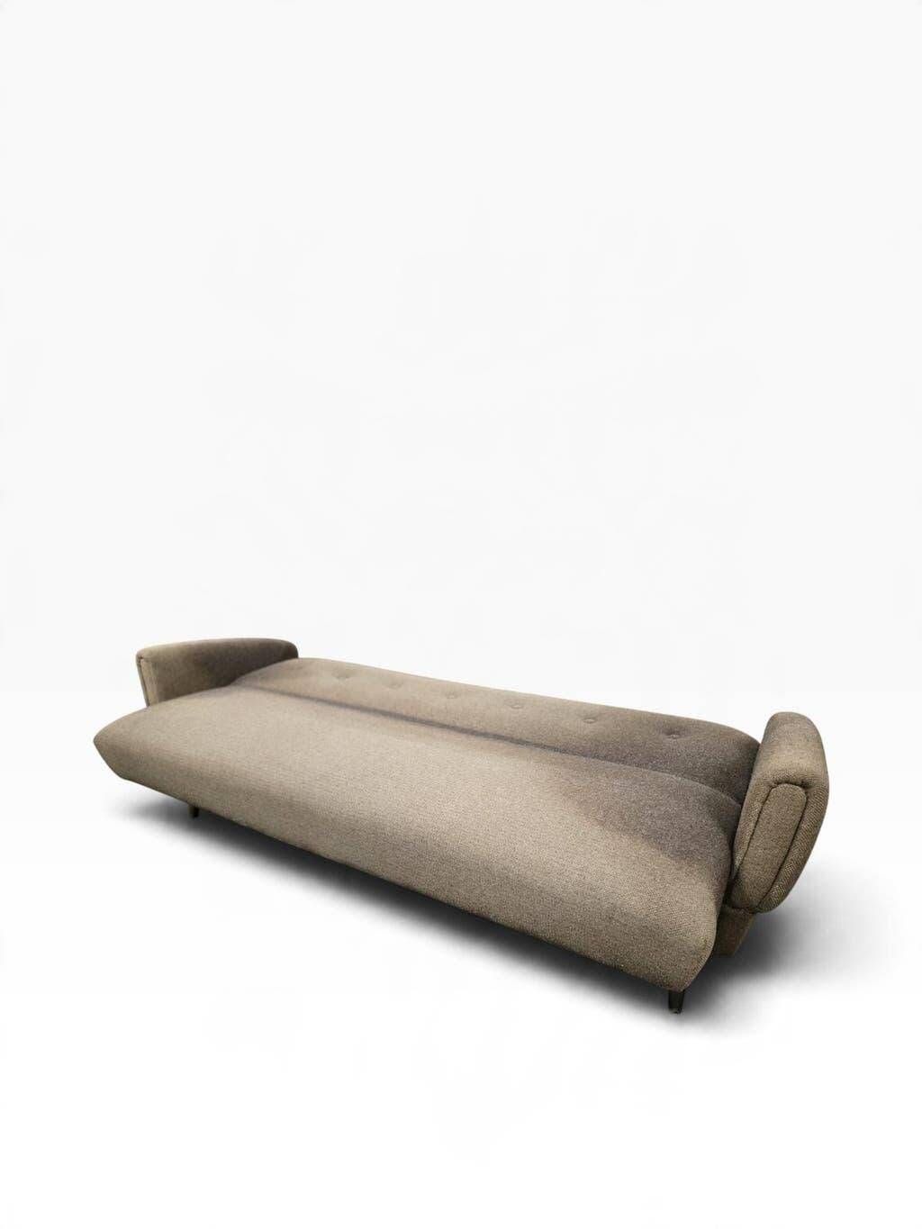 Vintage armchair/sofa/lounge in taupe colour with a stain.