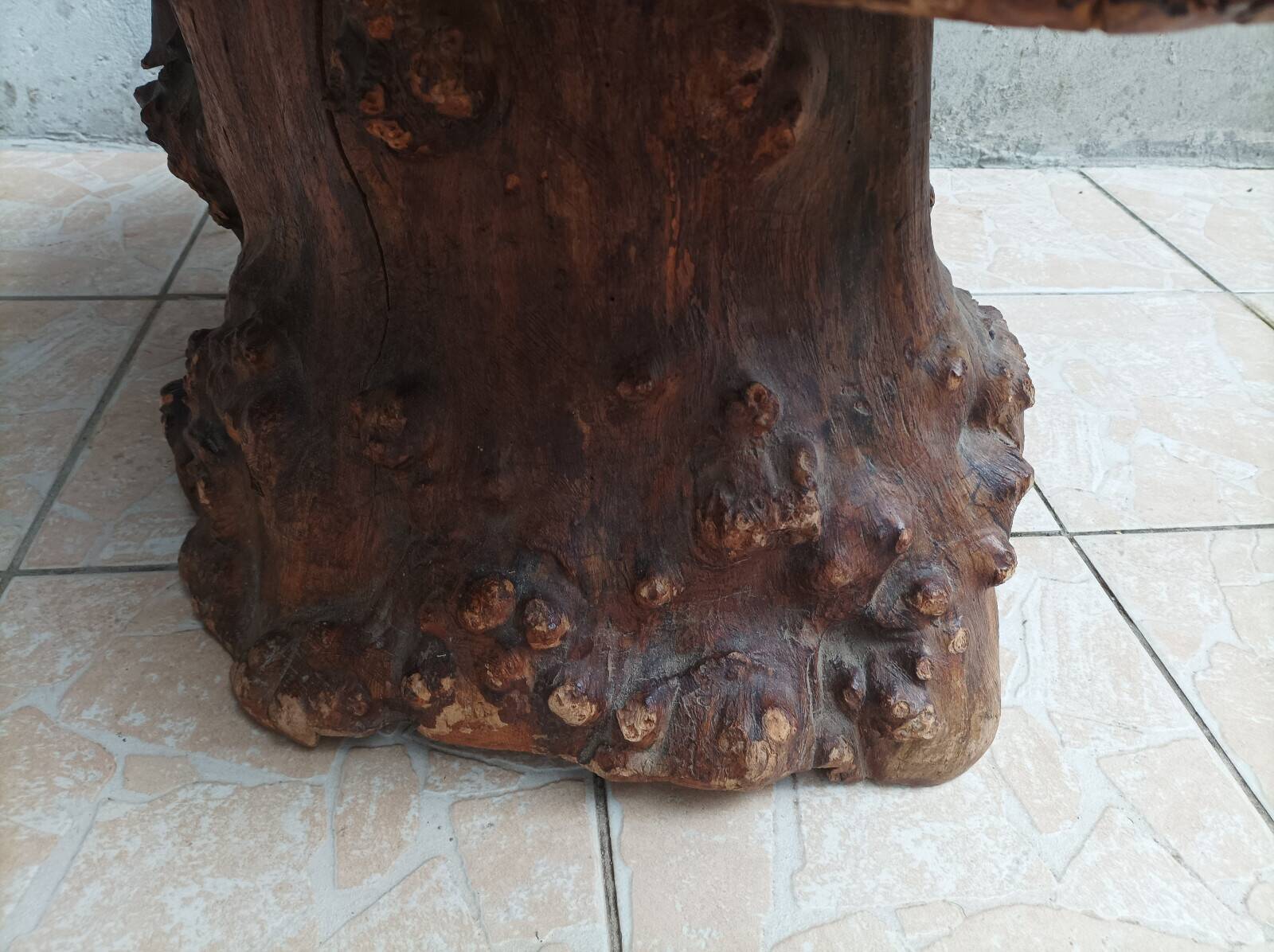 Brutalist chessboard coffee table made from tree stump.