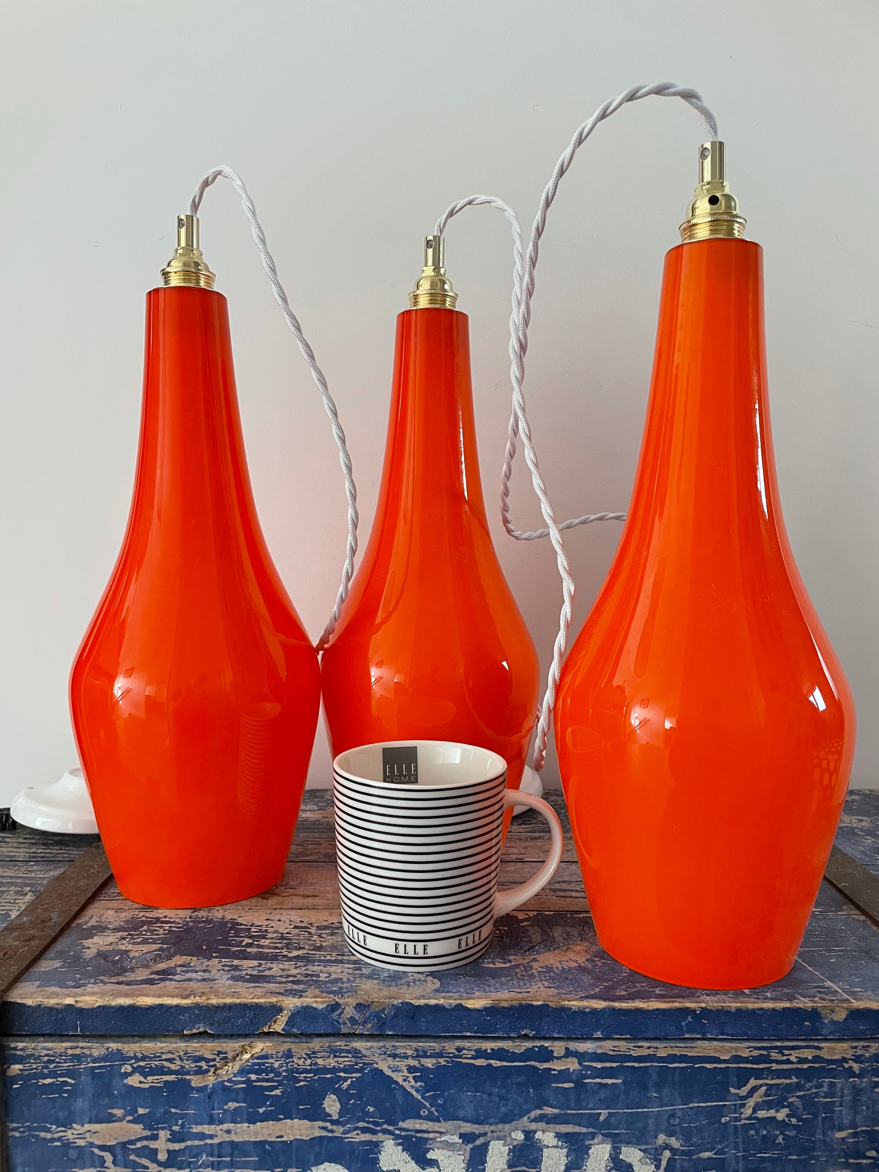 Set of three new electrified orange vintage pendant lamps