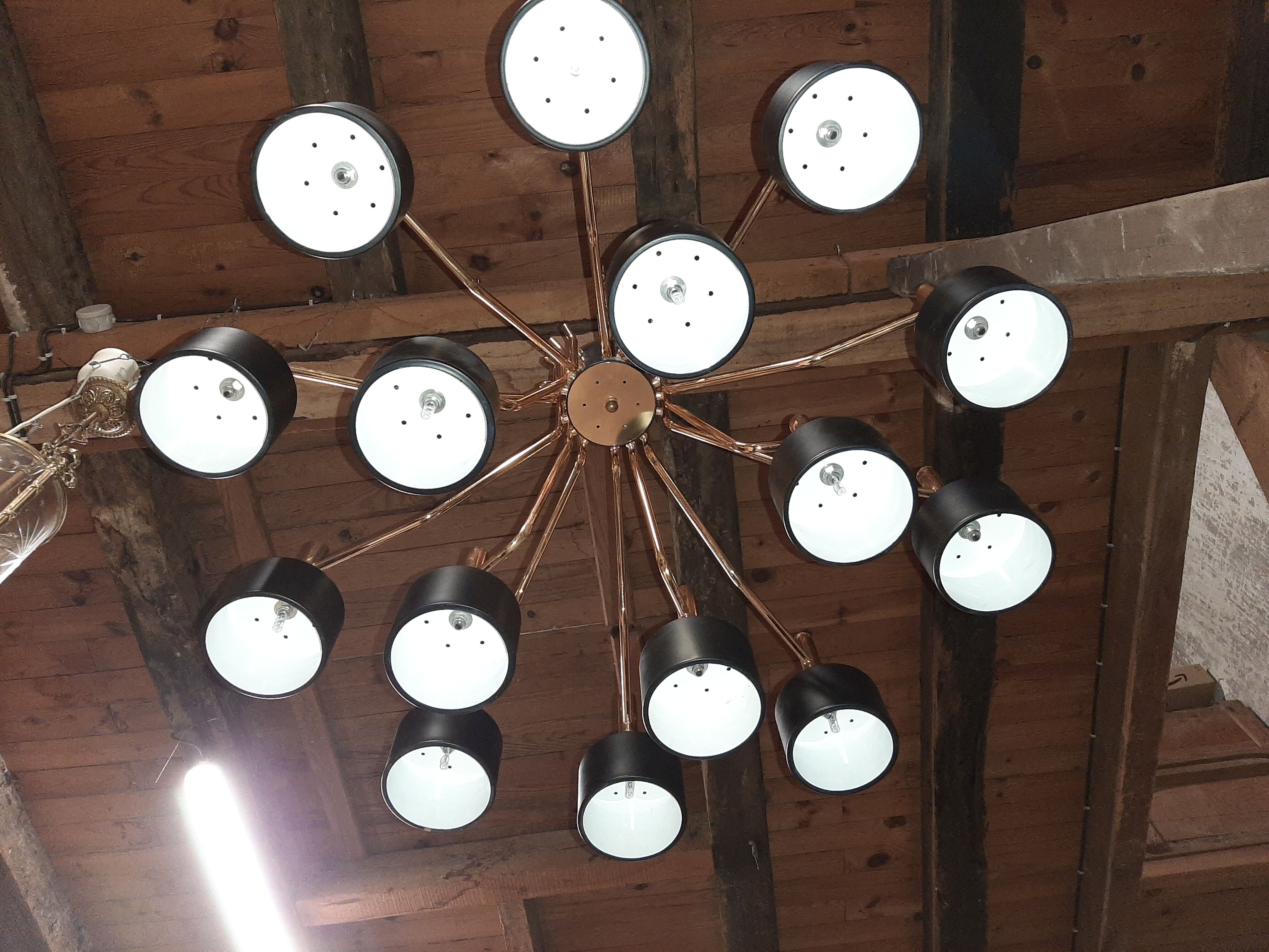 Black chandelier and gilded metal