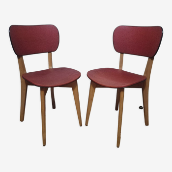 Two vintage chairs wood and mottled red vinyl