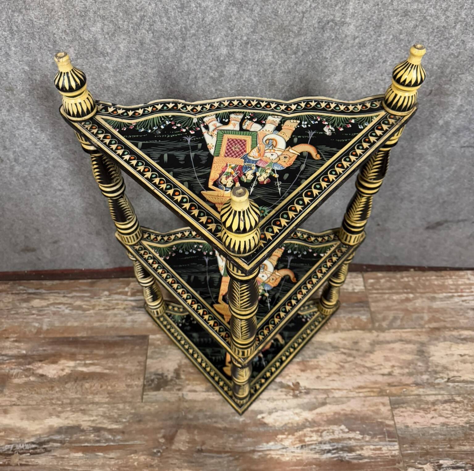 India circa 1900: attractive corner shelf in lacquered and painted wood