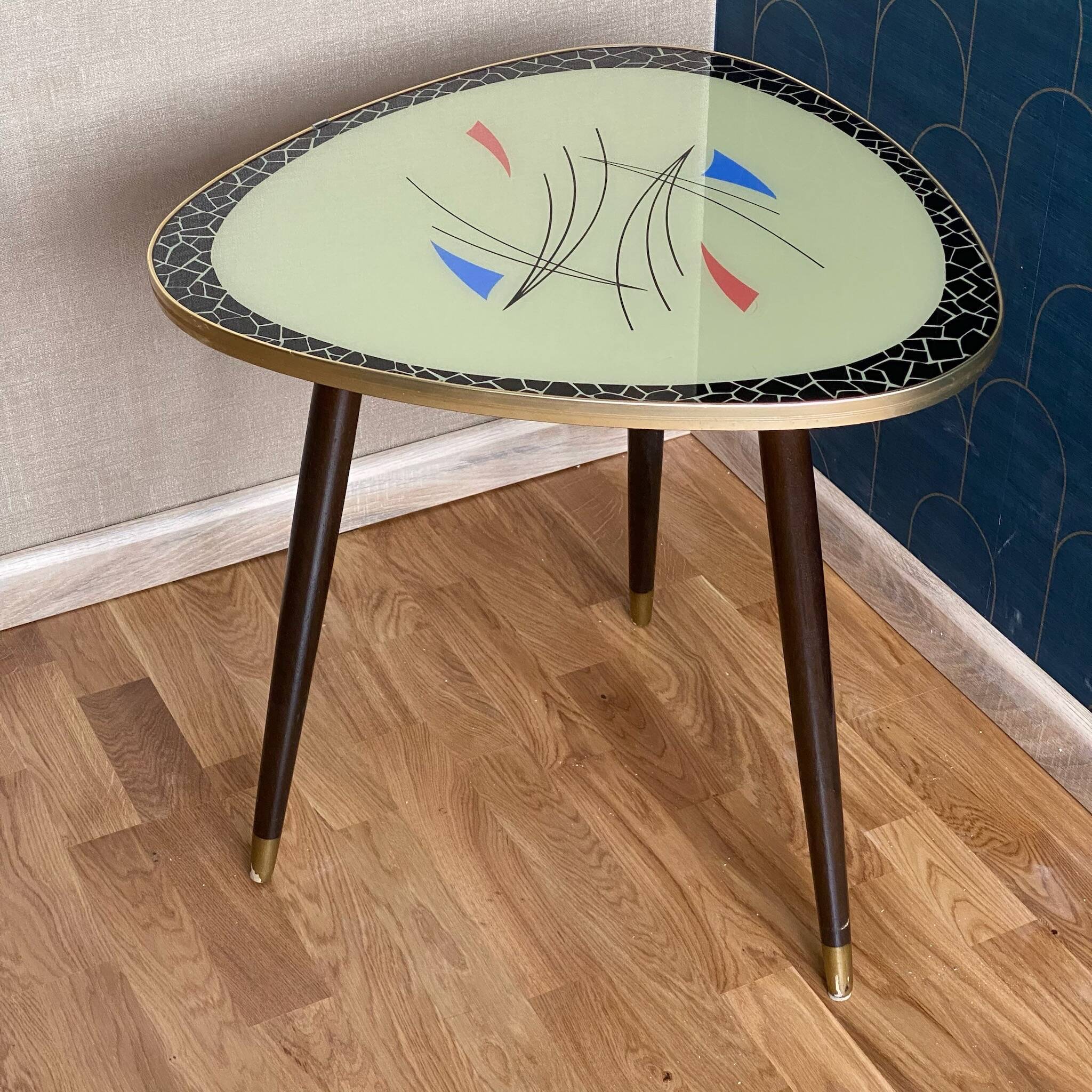 Triangular coffee table with vintage glass top