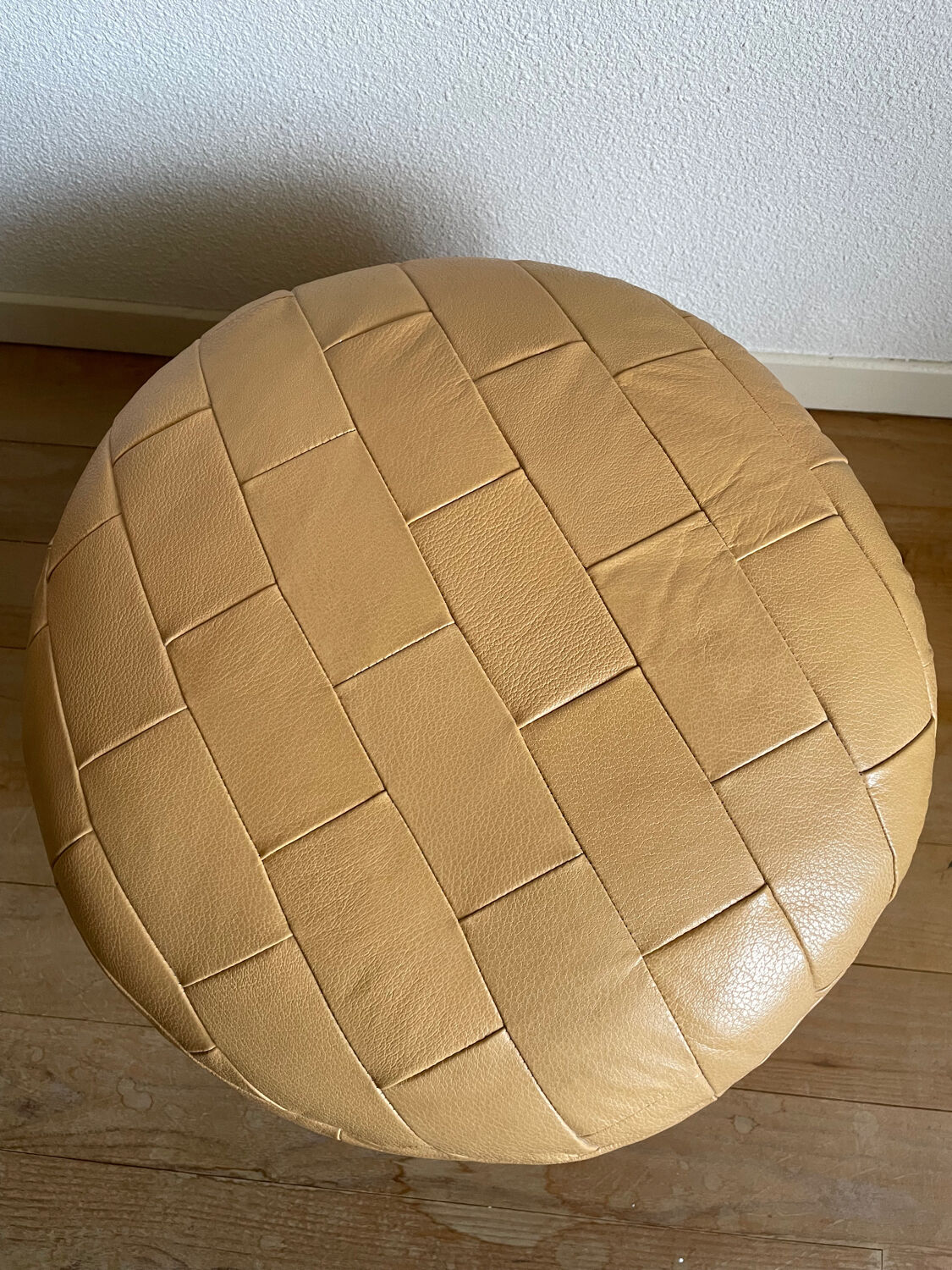 Beige patchwork leather pouf from Sède