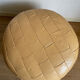 Beige patchwork leather pouf from Sède