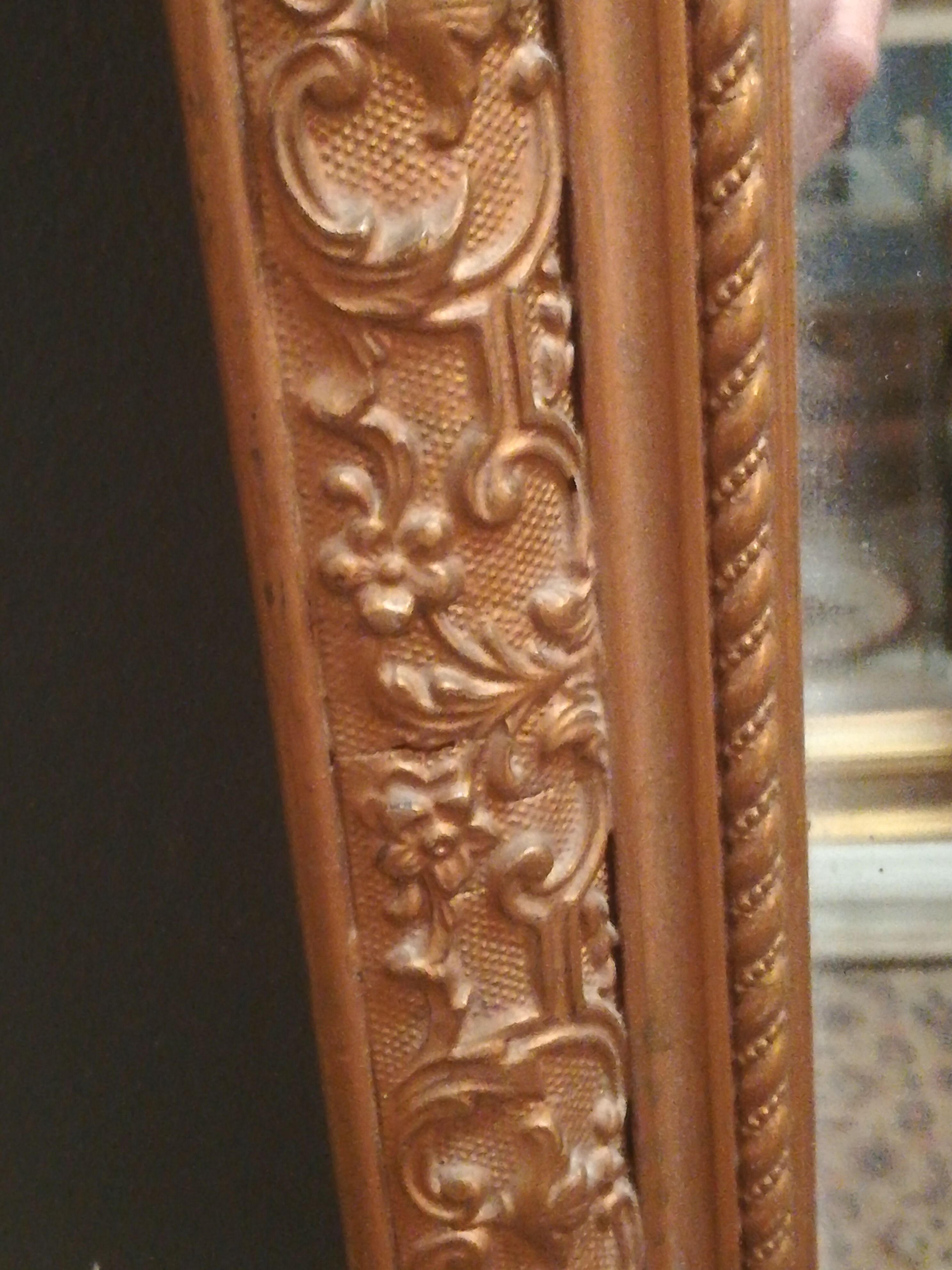 High and narrow mirror in gilded stucco late nineteenth century