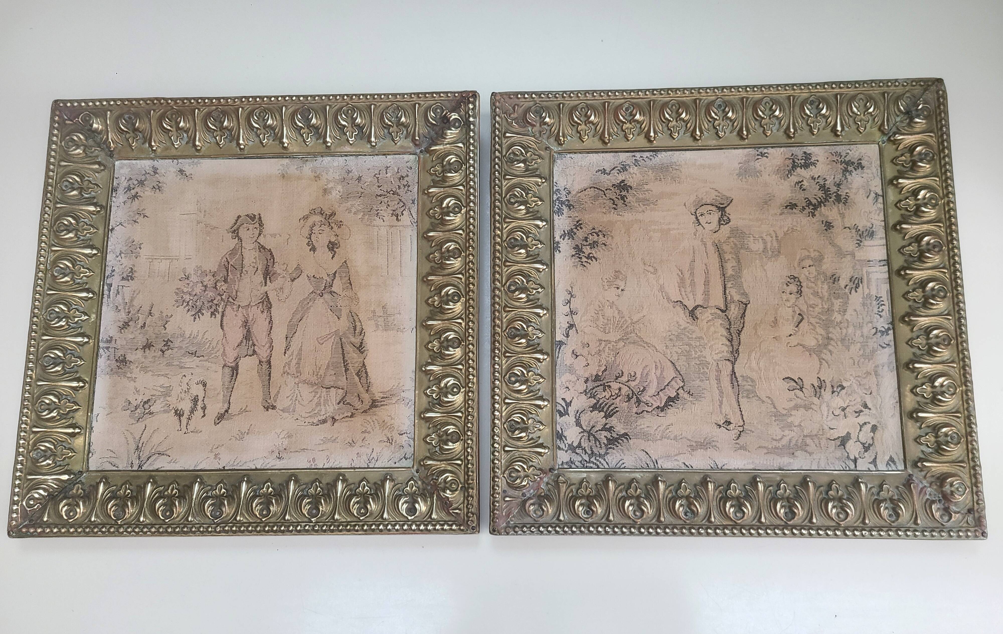 Antique tapestries framed in repoussé brass.