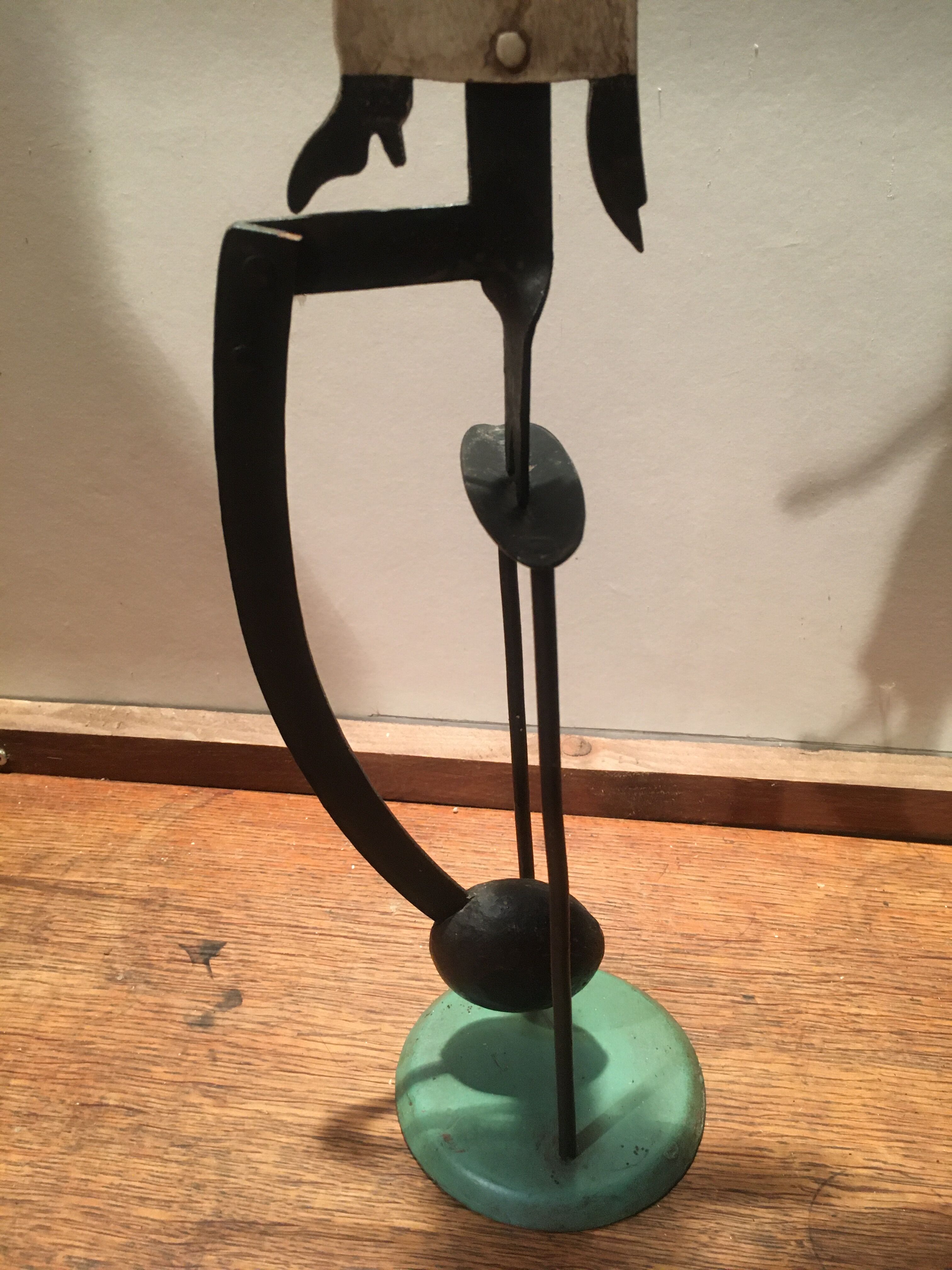 Woman with metal umbrella, pendulum