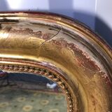 Louis Philippe's era mirror with a gold leaf pediment