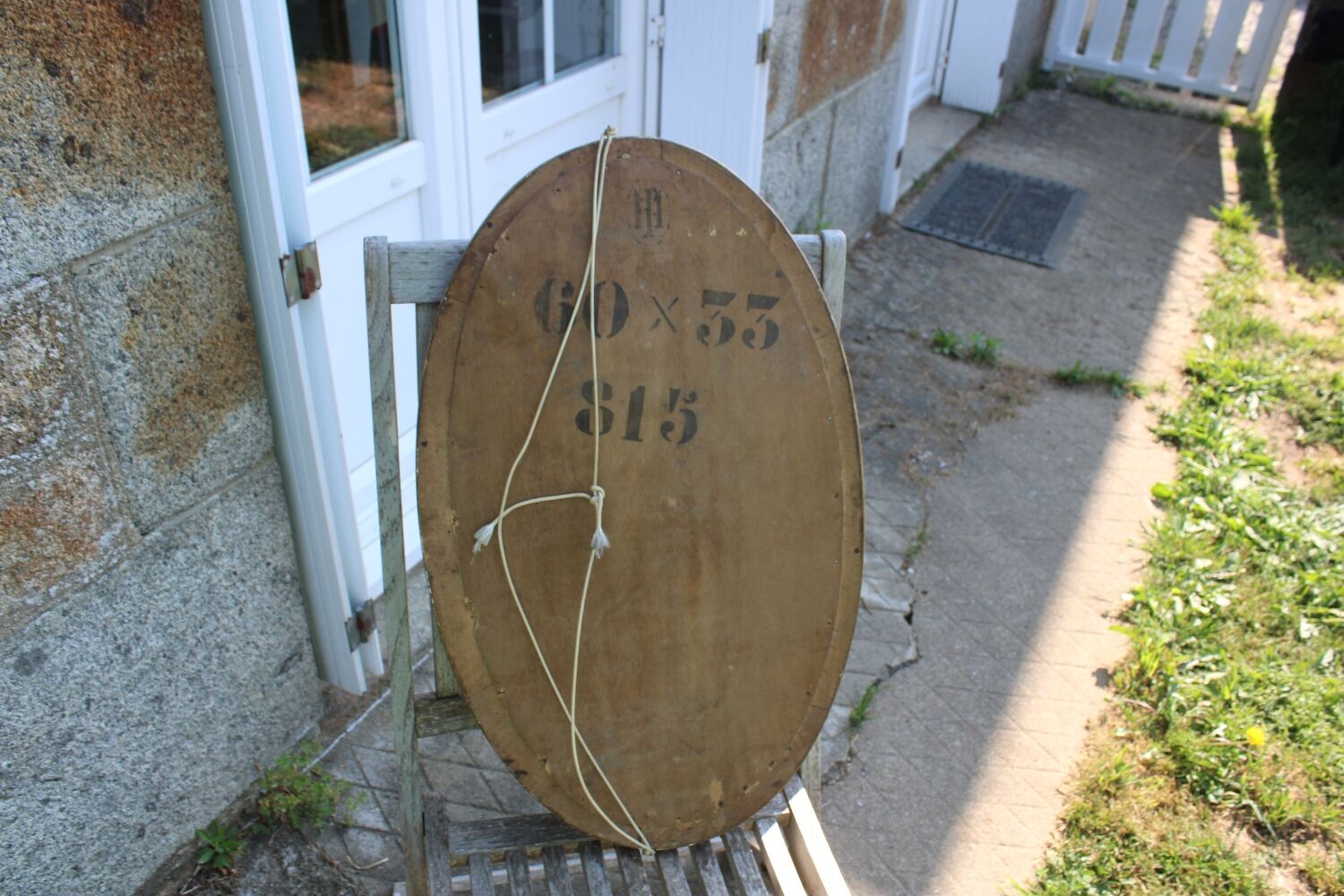 Bevelled oval antique mirror
