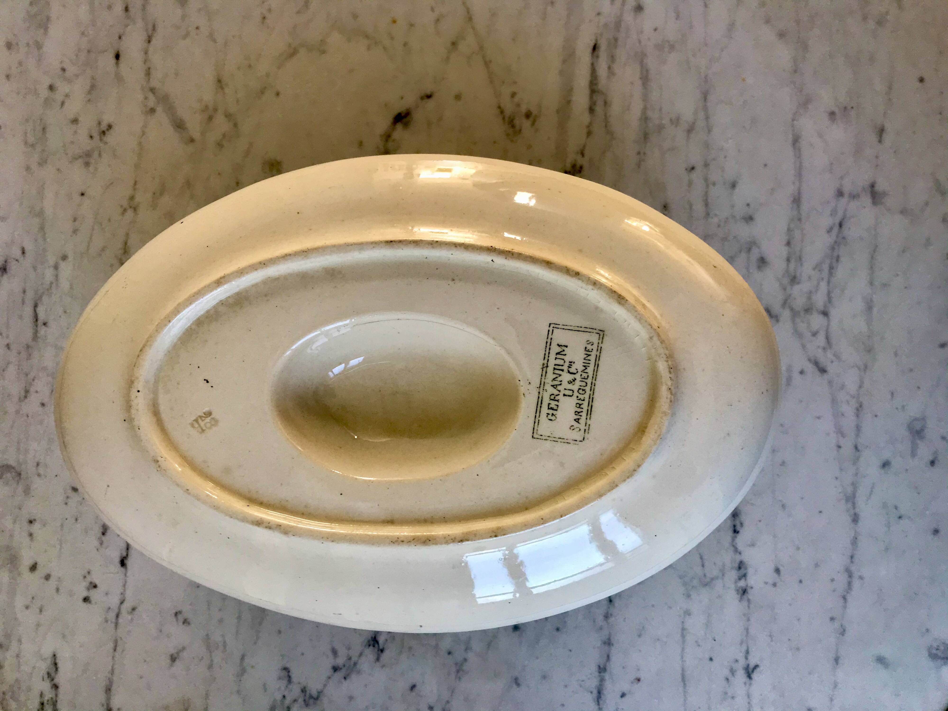 gravy boat in Terre de Fer Digoin Sarreguemines model "Géranium" green late 19th century