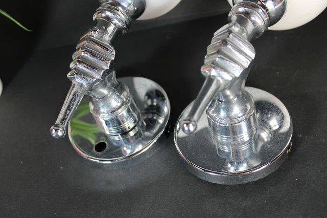 Pair of chrome-plated metal wall lights, hand-shaped with lampshade