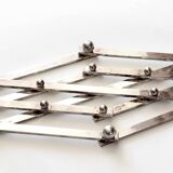 Silver metal extendable trivet