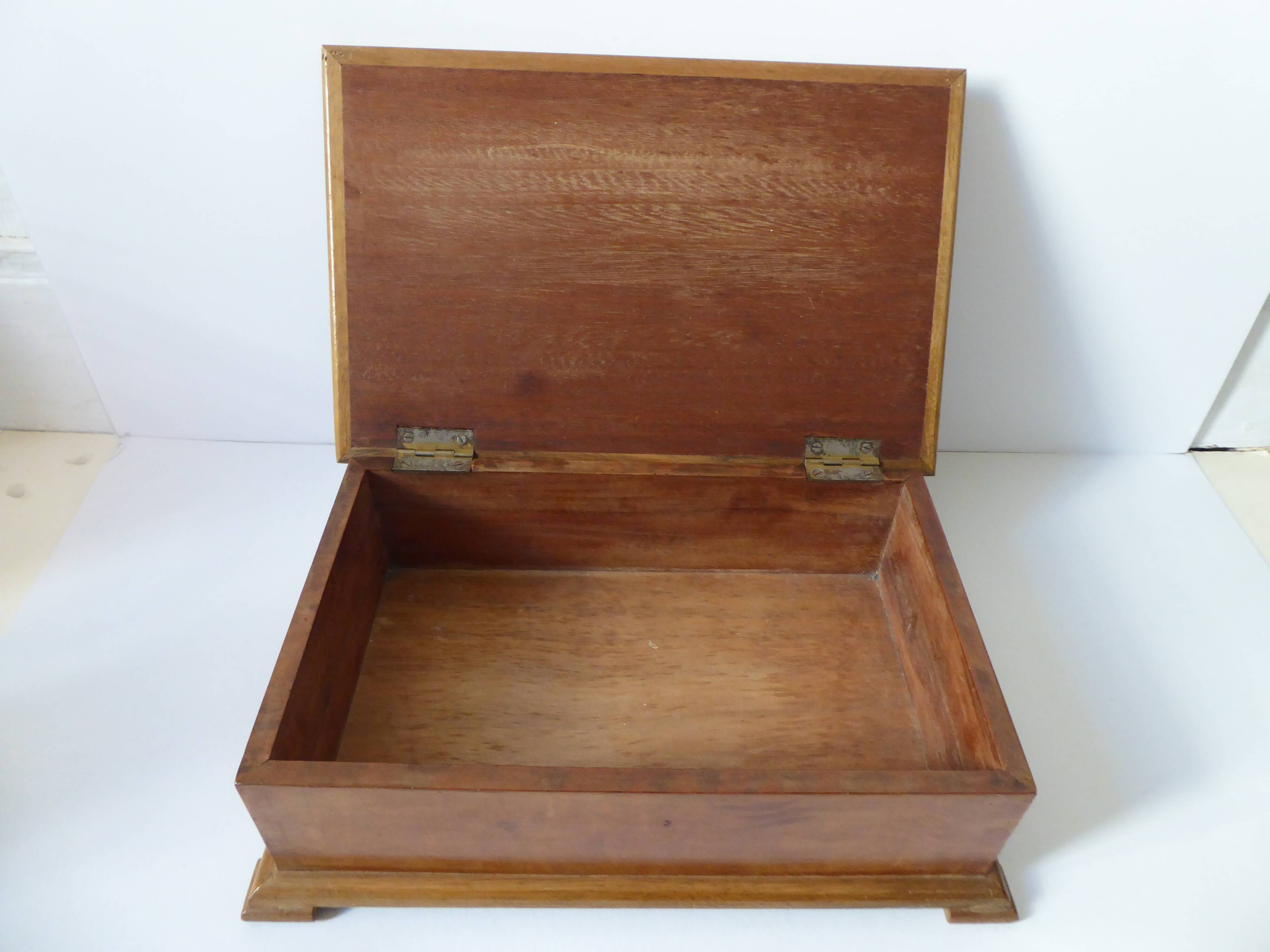 Branded wooden box decorated with suns