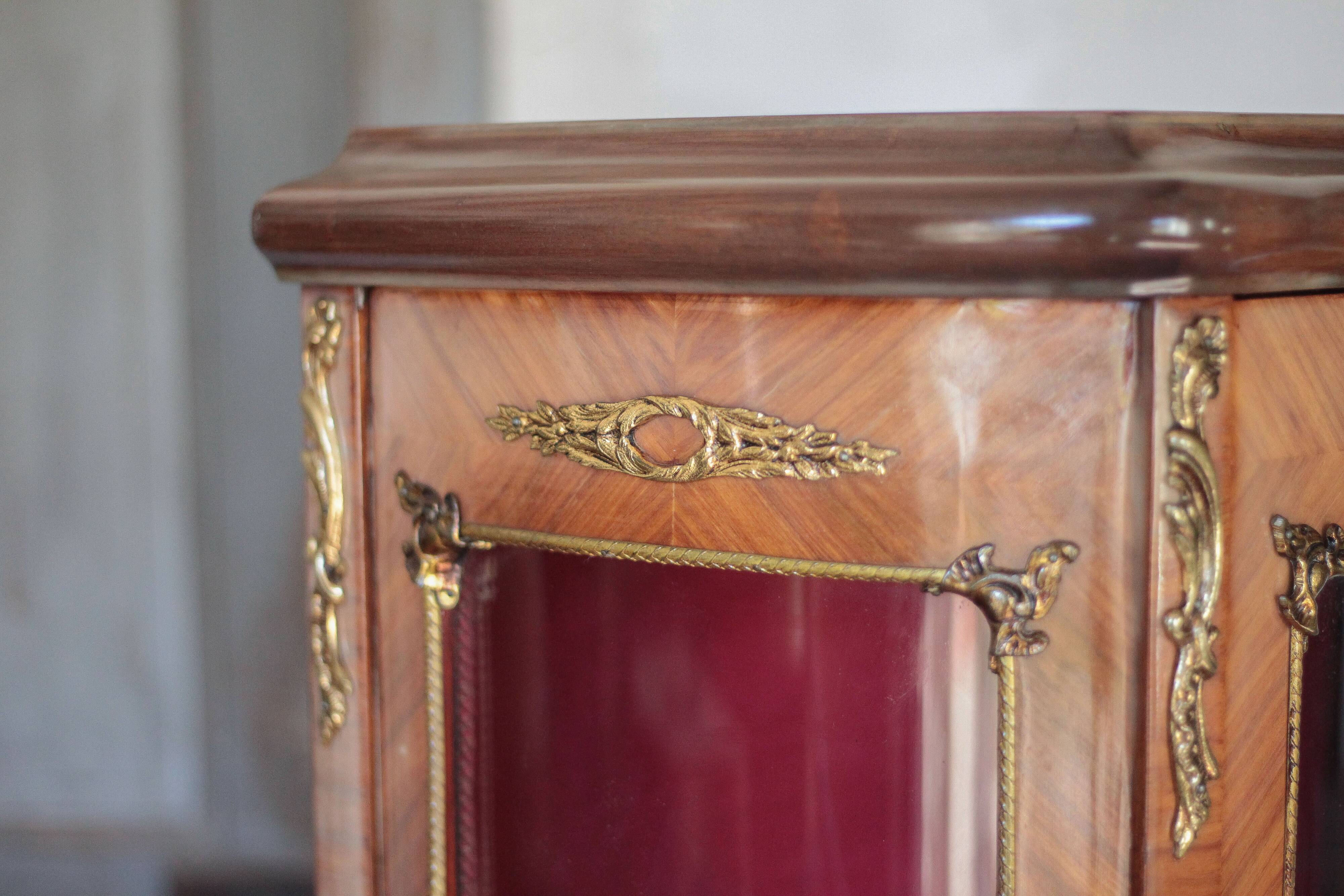 Marquetry display cabinet, curved Louis XV style, signed Marquant