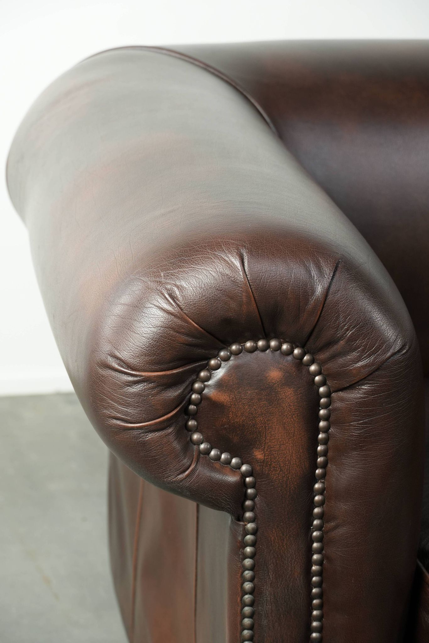 Set of a smooth chesterfield sofa and armchair with a timeless English look
