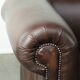 Set of a smooth chesterfield sofa and armchair with a timeless English look
