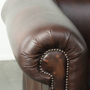 Set of a smooth chesterfield sofa and armchair with a timeless English look