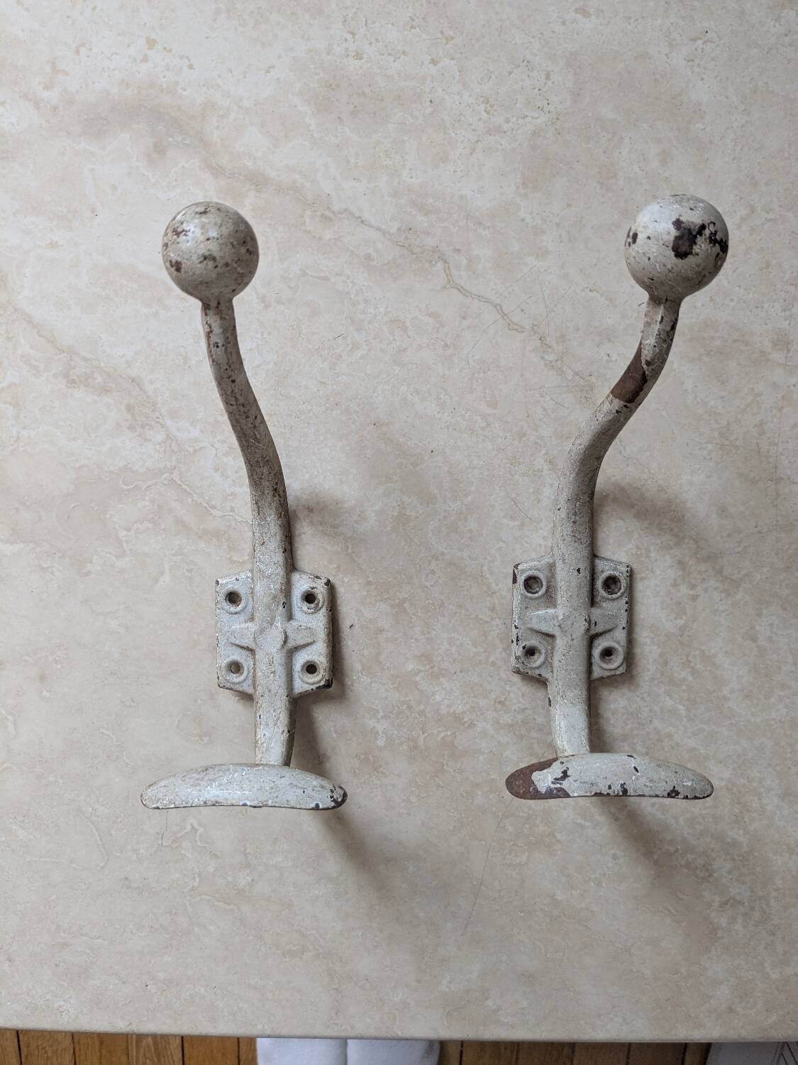Two vintage coat hooks