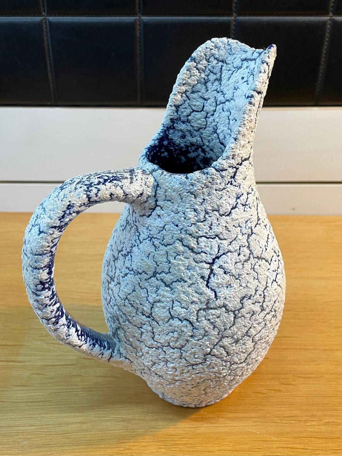 White and blue crisped ceramic pitcher