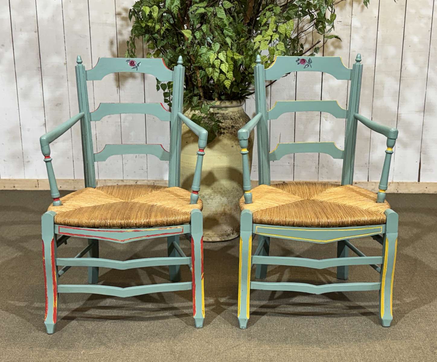 Pair of rustic armchairs in beech with straw seats.