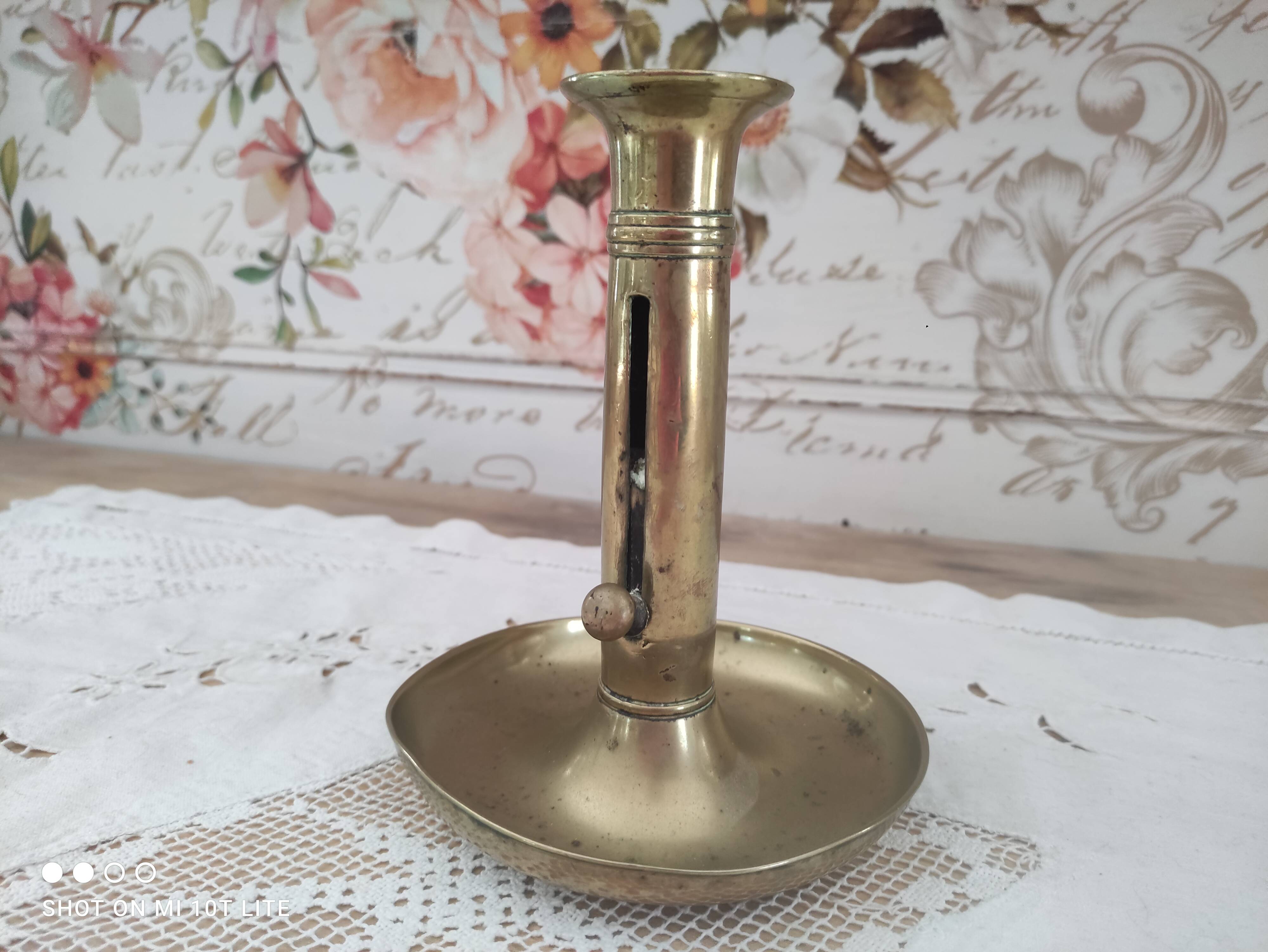Brass push candle holder on frame