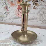 Brass push candle holder on frame