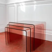 Vintage trio of nesting tables in smoked plexiglass by Michel Dumas, year