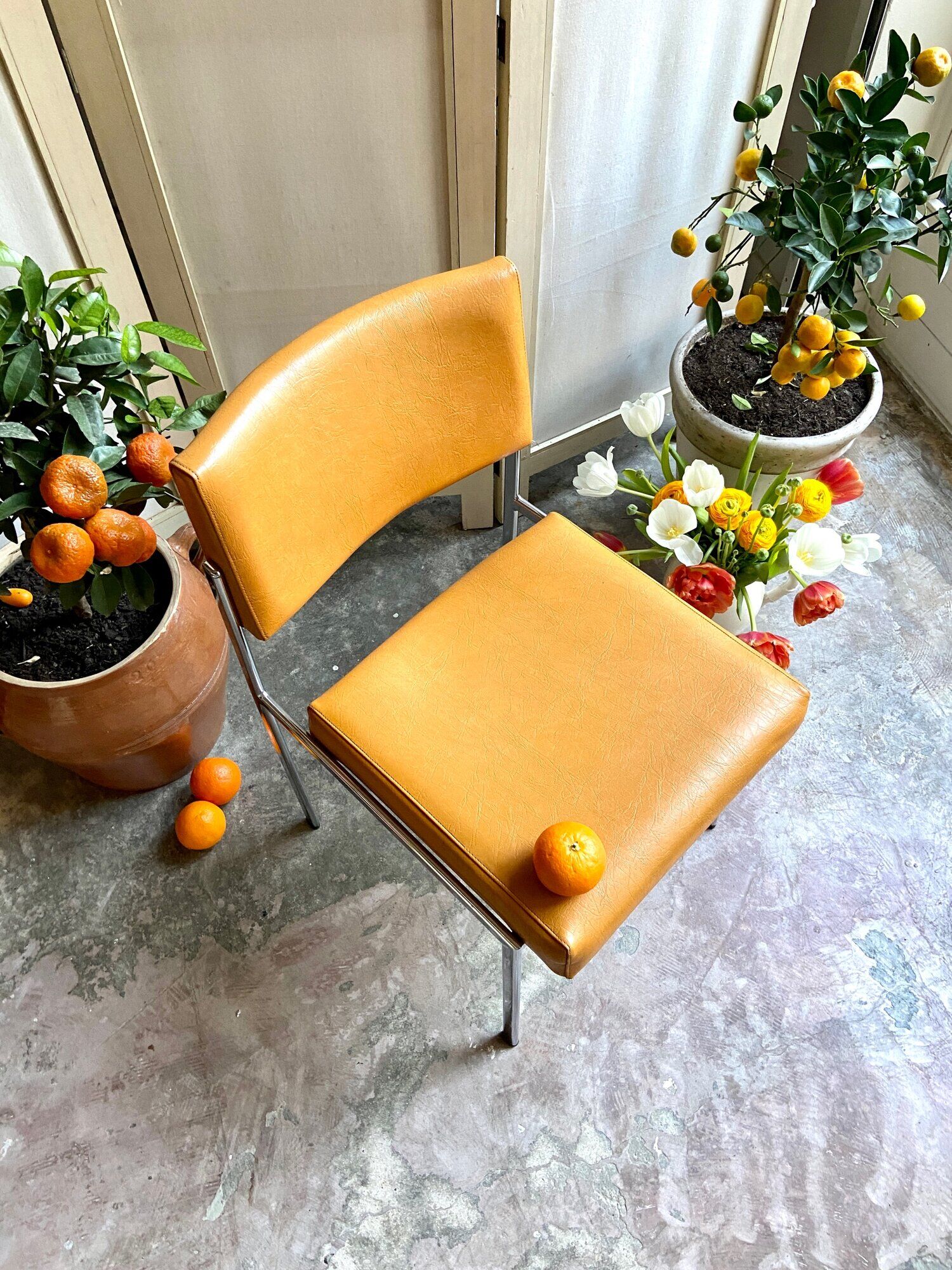 Chair in chromed metal and ochre skaï 1970s