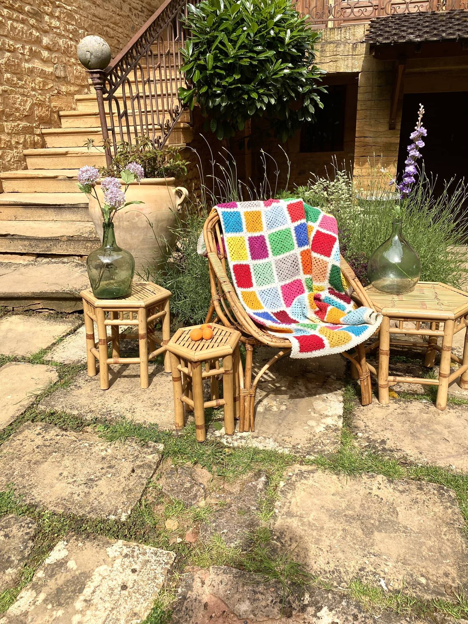 Set of three vintage rattan side tables.