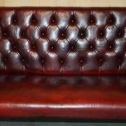 Victorian Chesterfield leather sofa with carved lion heads.