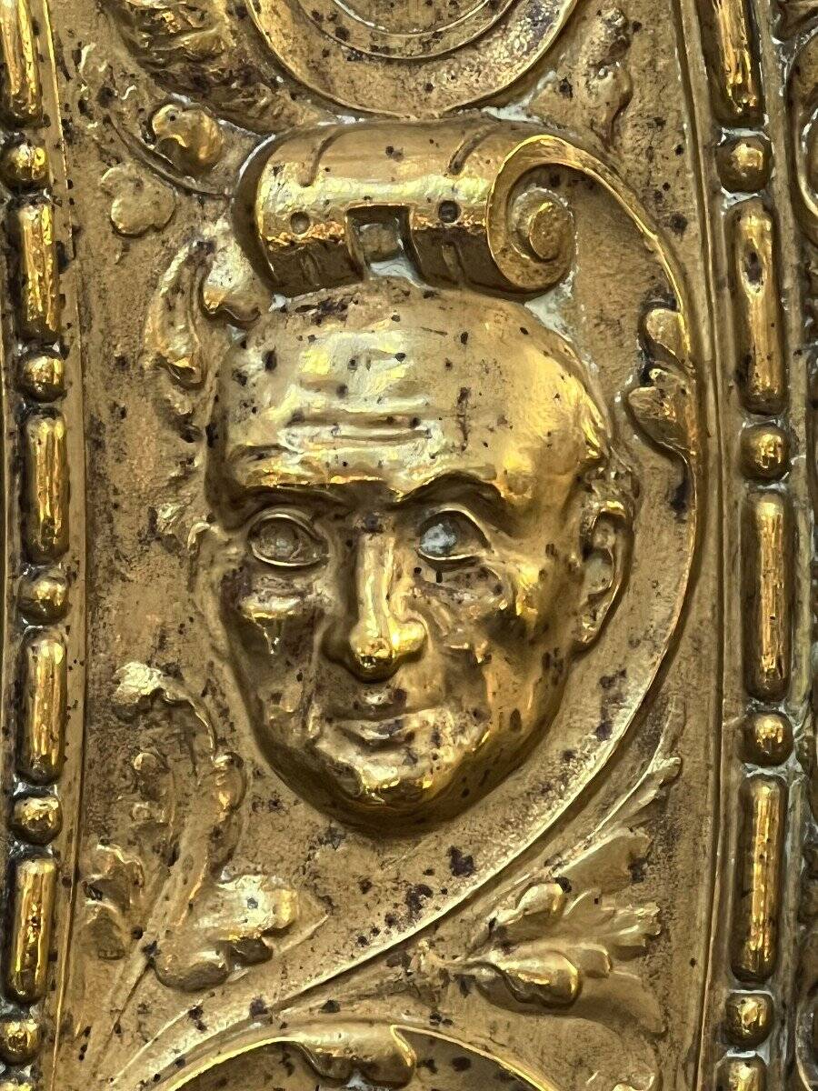 A. Arens, Antwerp, important oval mirror in repoussé brass with numerous animal decorations