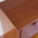 Vintage teak bar cabinet with black glass interior.