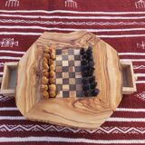 Rustic handmade chessboard made of olive wood