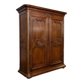 Important Louis XV period wardrobe, richly moulded in solid walnut.