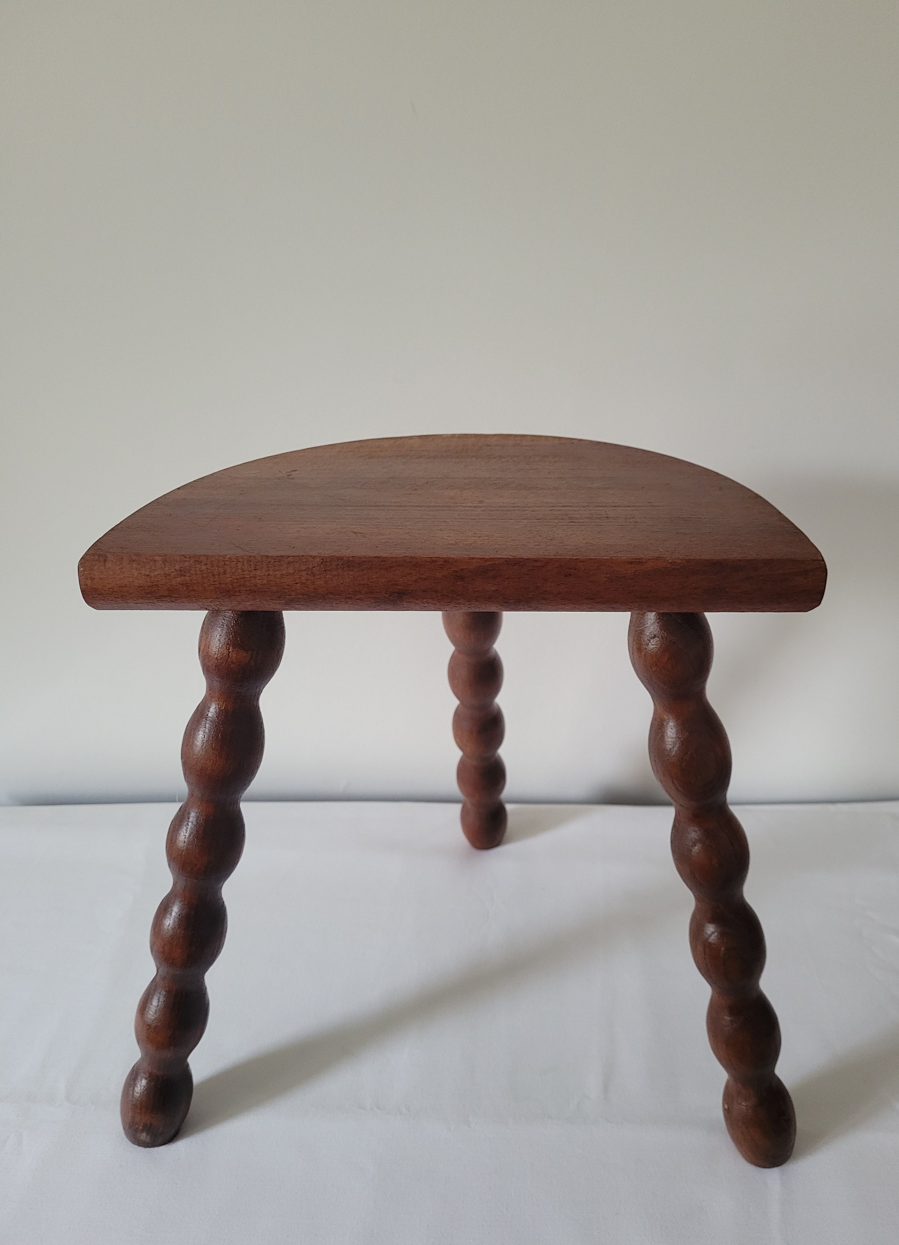 Brutalist stool turned wooden feet
