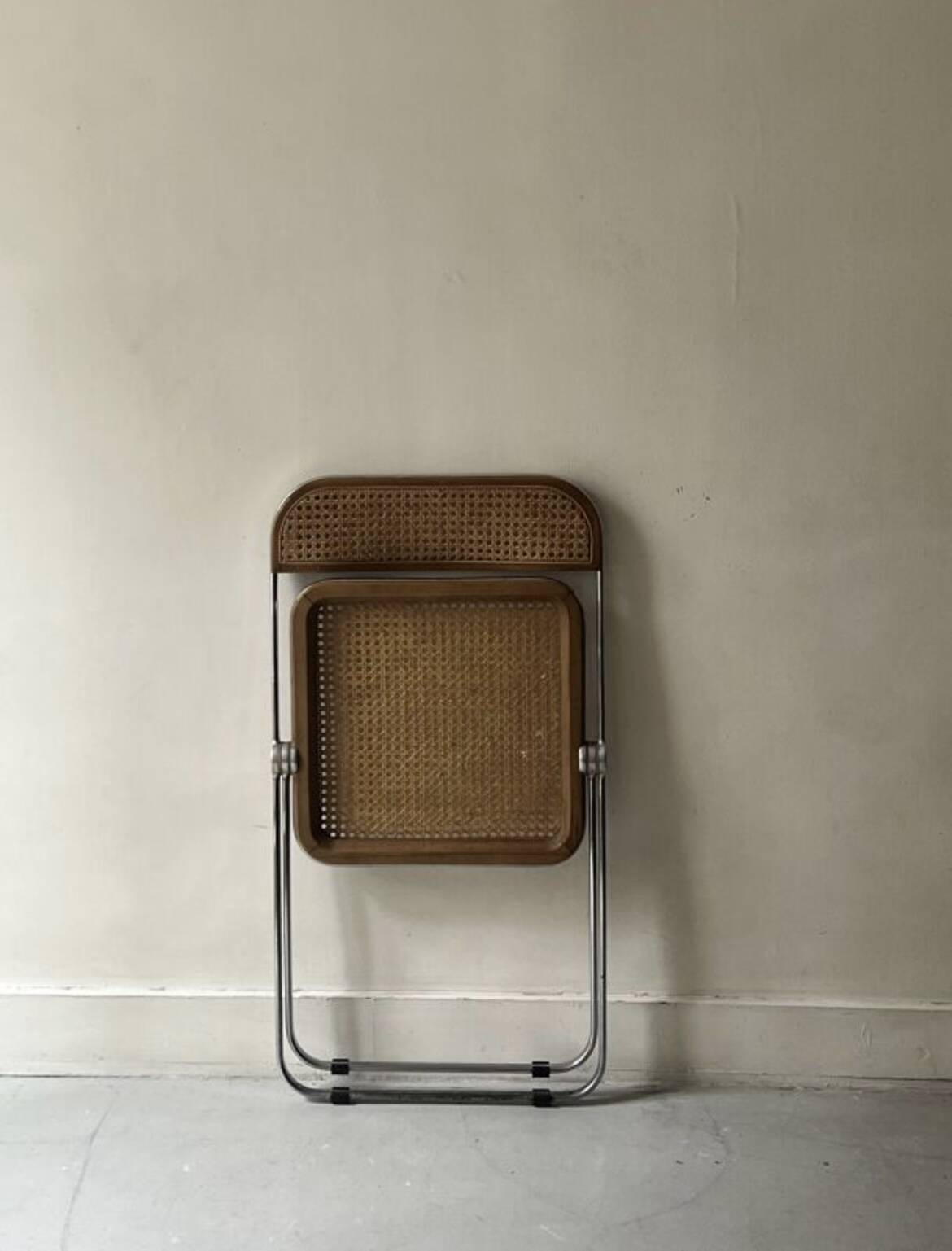 Plia folding chair in chrome and cane by Giancarlo Piretti, design 1970.