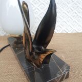 Art Deco swan and white globe table lamp with black marble base