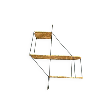 Wall shelf made of rattan and wrought iron