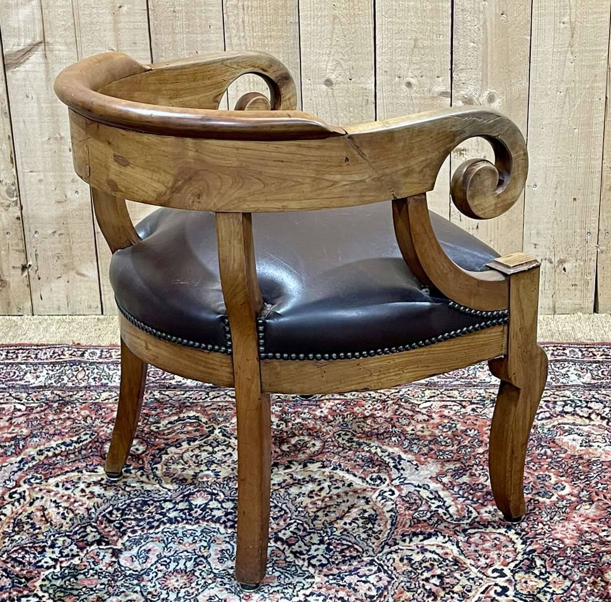 19th century French armchair in cherry wood and leather seat