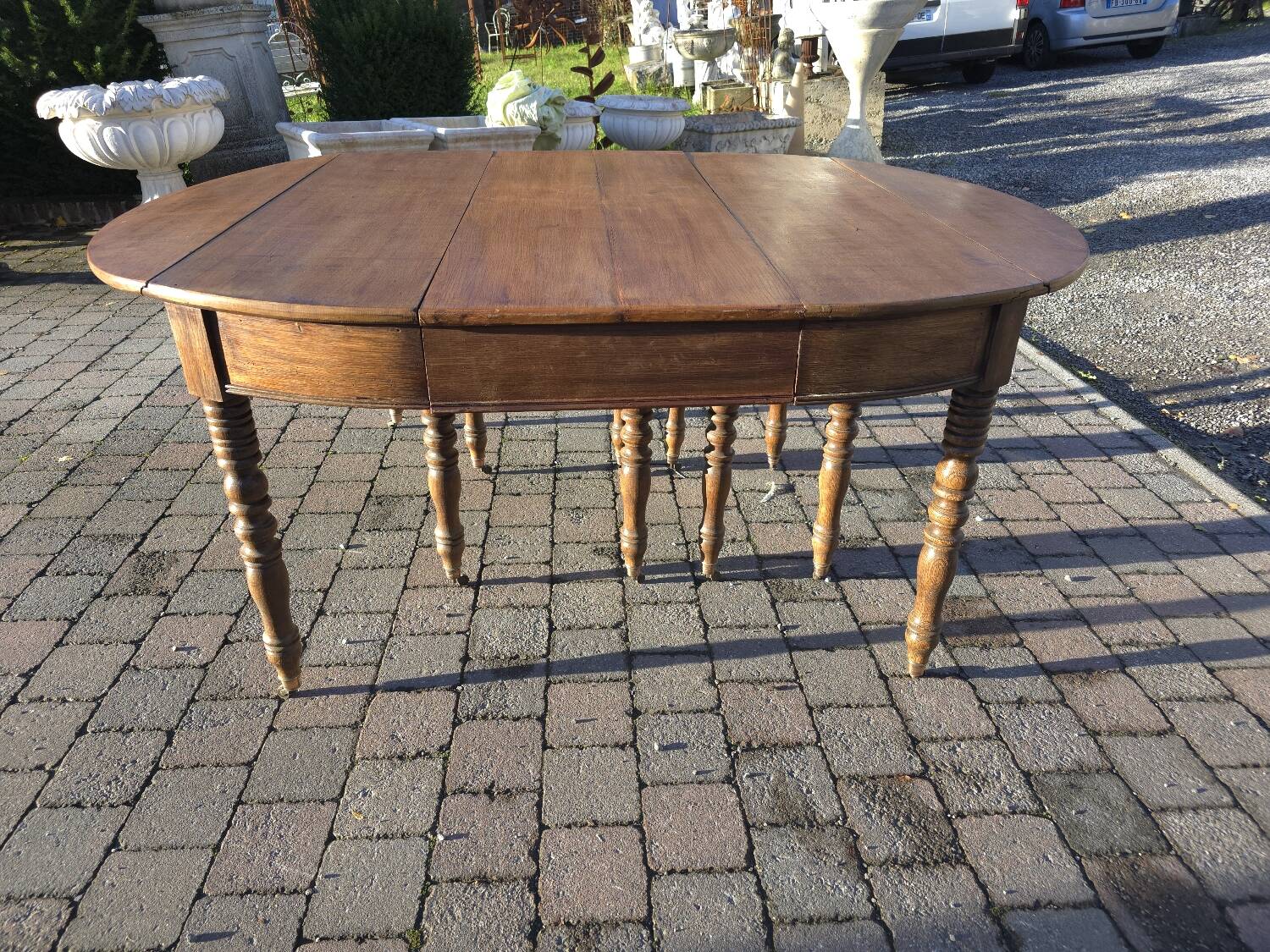 12-foot round oak table with 7 extensions / 20 people