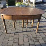 12-foot round oak table with 7 extensions / 20 people