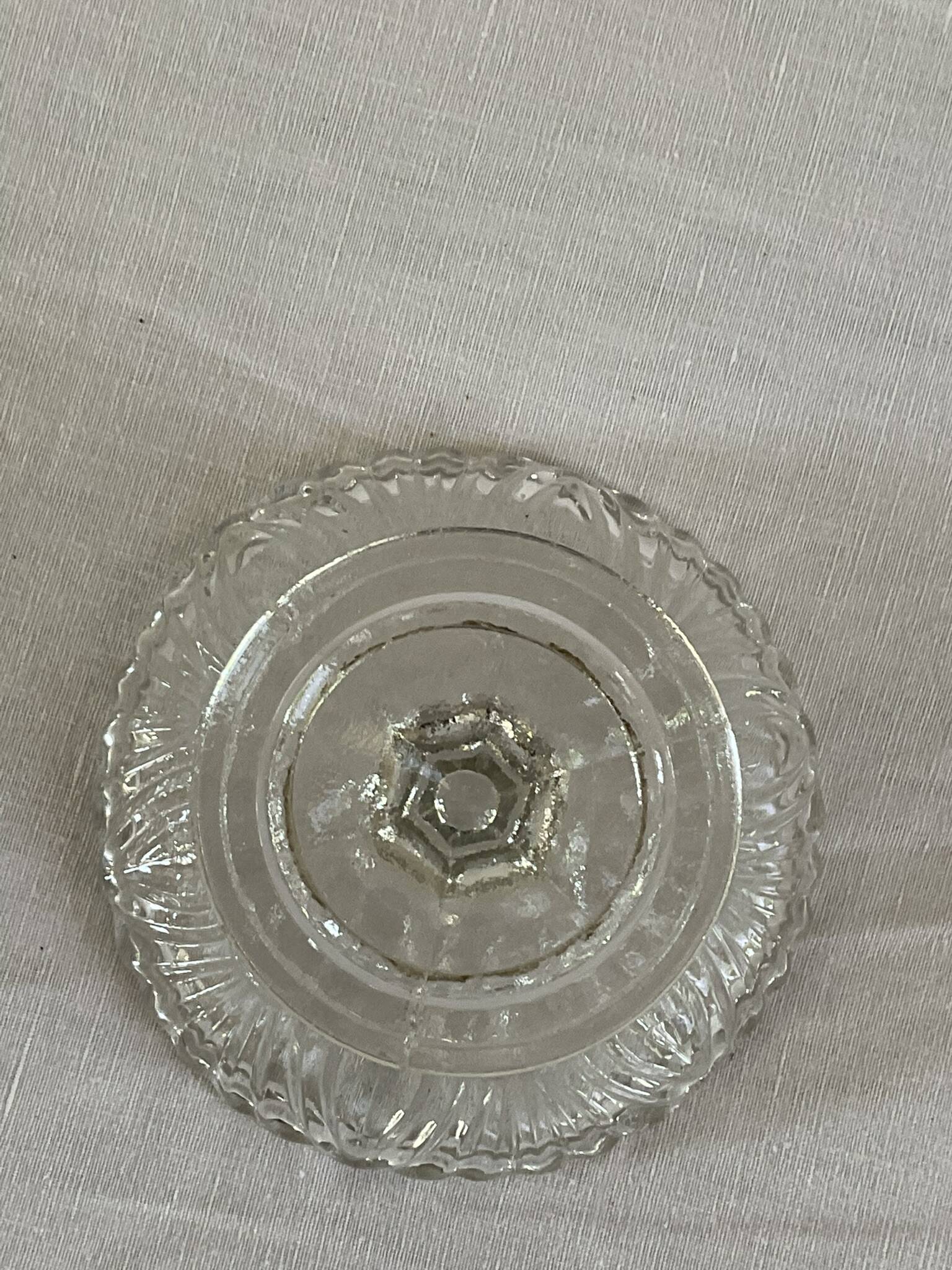 Small vintage footed bowl, made of clear moulded glass.
