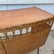 Vintage 1950s bar counter with its two rattan and metal stools.