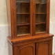 English showcase in two mahogany bodies and 19th century veneer