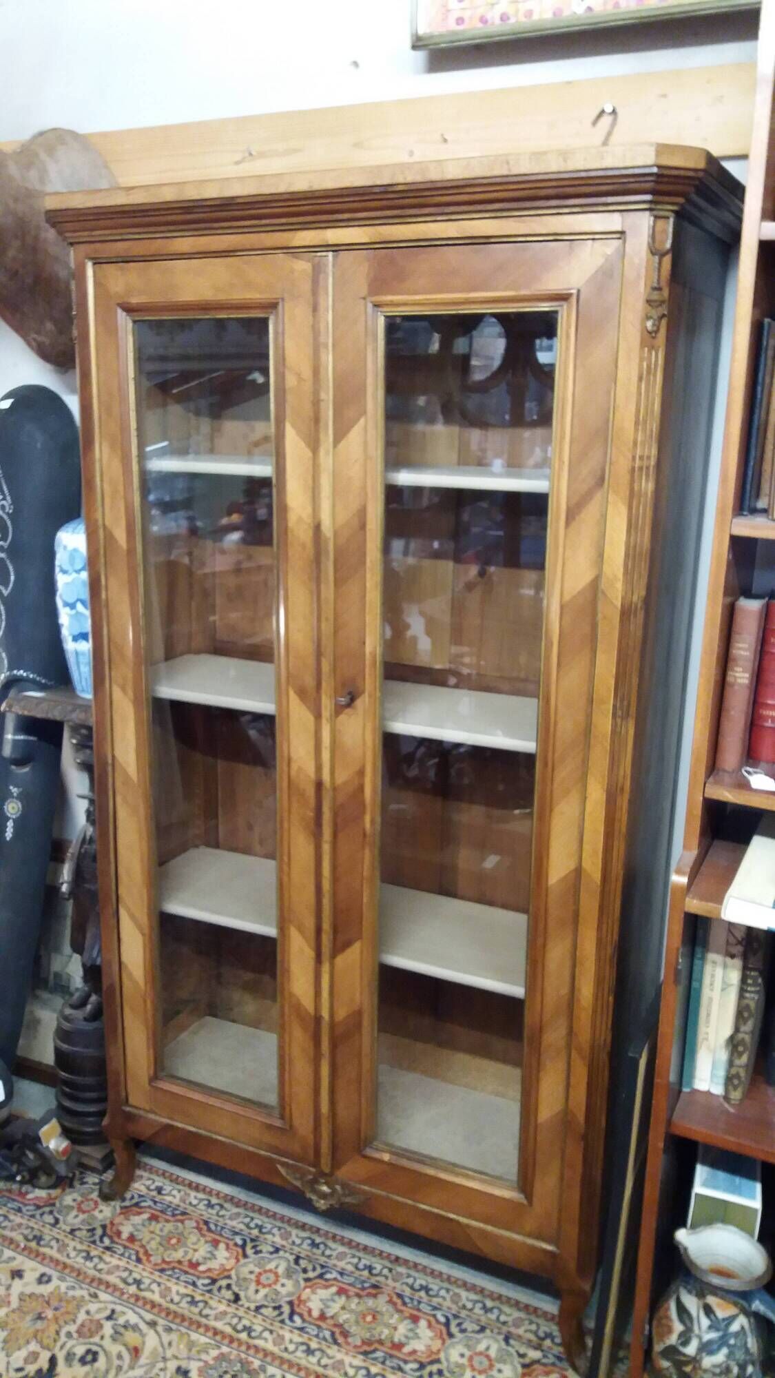Two-door display cabinet in transitional style.