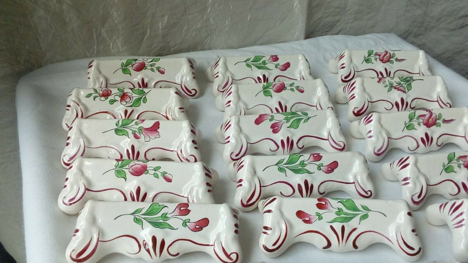 Suite of 18 knife holders in faience of luneville model reverbere