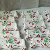 Suite of 18 knife holders in faience of luneville model reverbere